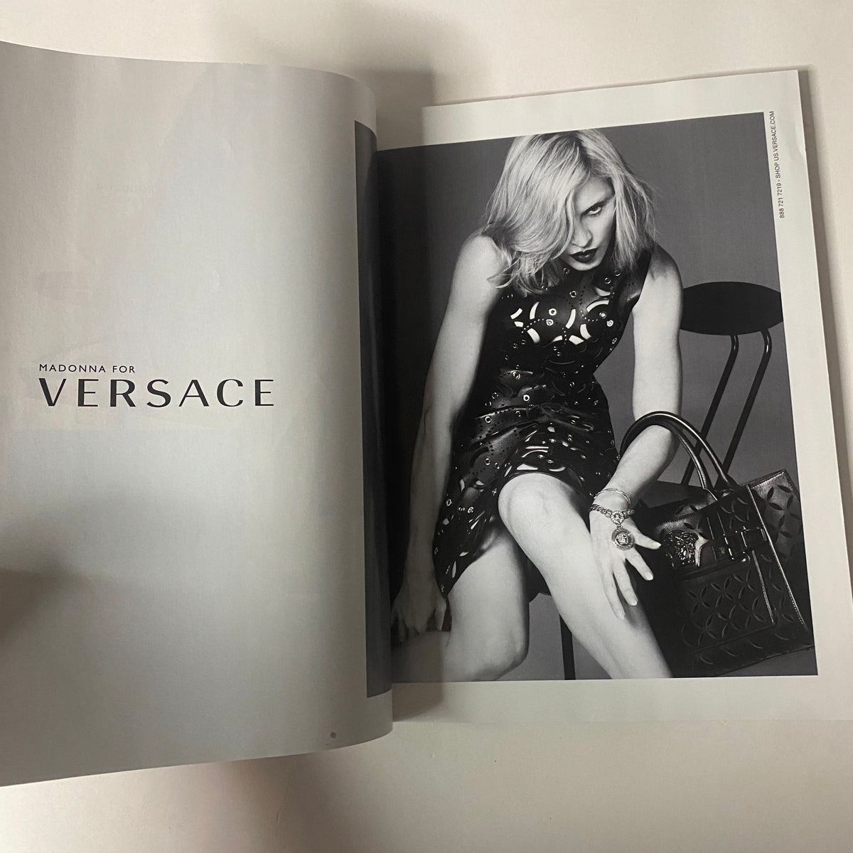 Vogue Magazine February 2015 Dakota Johnson Cover displaying a fashion spread with Madonna for Versace, showcasing modern trends in black and white.