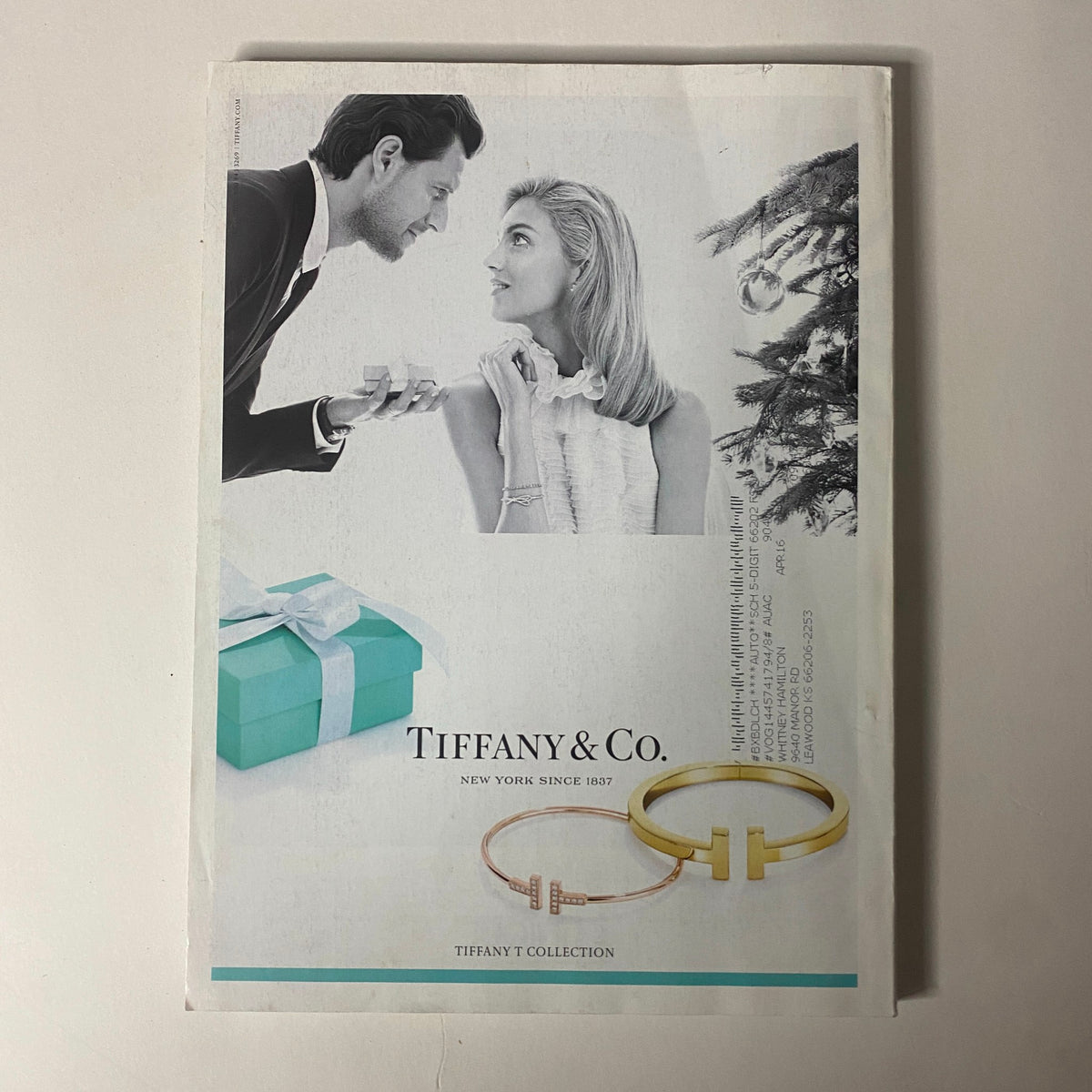 Advertisement from Vogue Magazine December 2015 for Tiffany & Co., featuring gift ideas and stylish products in the edition with Jennifer Lawrence on the cover.