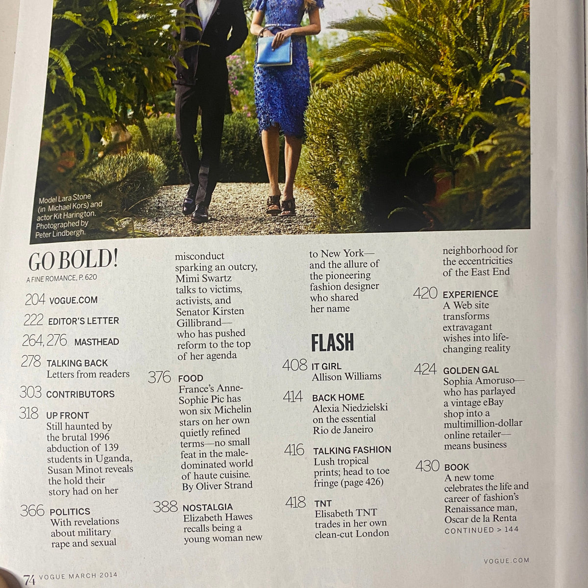 Vogue Magazine March 2014 Rihanna Cover No Label VG showcasing an elegant couple walking through lush greenery, emphasizing bold fashion choices.