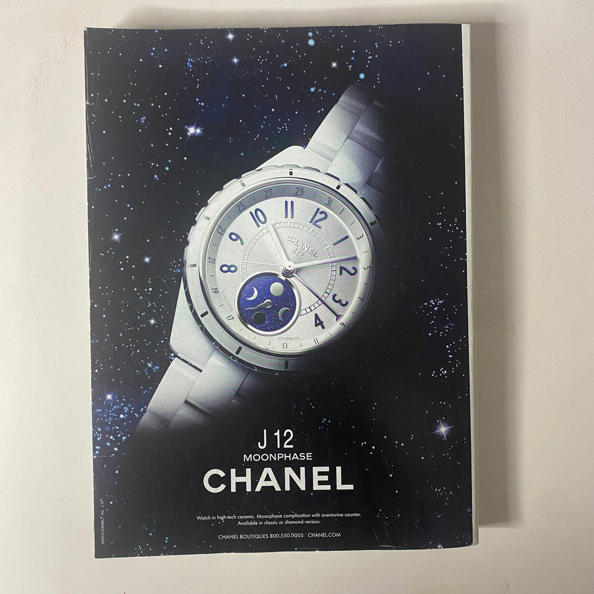 Vogue Magazine March 2014 Rihanna Cover No Label VG featuring a luxurious Chanel watch ad, highlighting the brand's elegance and timeless designs.