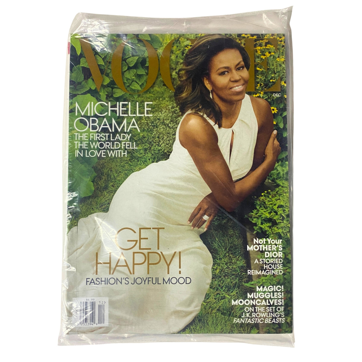 Vogue Magazine December 2016 featuring Michelle Obama on the cover, showcasing her in a white dress, celebrating her legacy as First Lady. This collectible issue emphasizes a joyful fashion theme.
