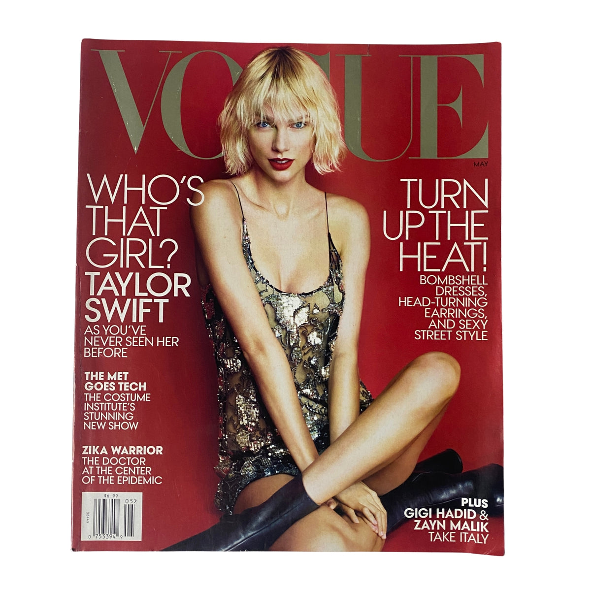 Cover of Vogue Magazine May 2016 featuring Taylor Swift, showcasing a glamorous look with the title 'Who's That Girl? Taylor Swift' and the tagline 'Turn Up The Heat!' emphasizing fashion and style.