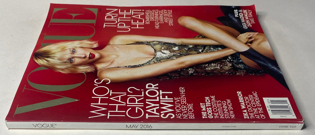 Side view of Vogue Magazine May 2016 with Taylor Swift on the cover, highlighting her stylish outfit and text 'Turn Up The Heat!' along with additional features within the issue.