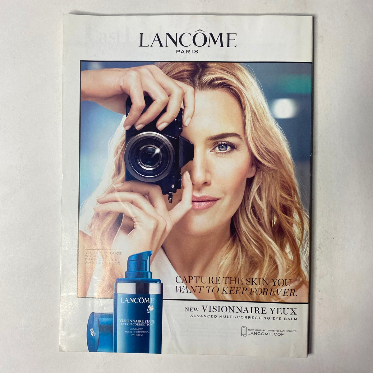 Advertising page from Vogue Magazine January 2017 featuring Lancome products, promoting skin care and beauty with a striking visual of a model.