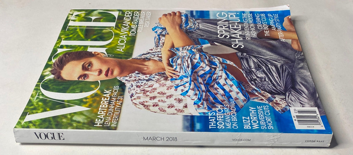 Side view of the Vogue Magazine March 2018 with Alicia Vikander on the cover. The image emphasizes the magazine's content promoting fashion, lifestyle, and cultural commentary.