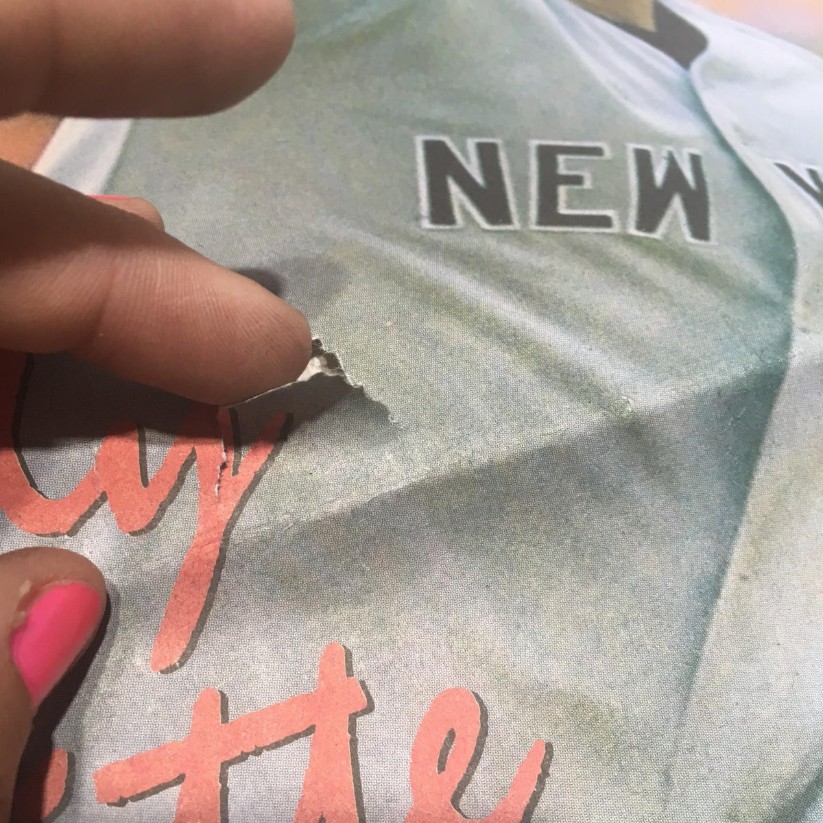 Detailed view of the Andy Pettitte Newsday magazine showing minor damage on the cover, emphasizing its vintage condition.