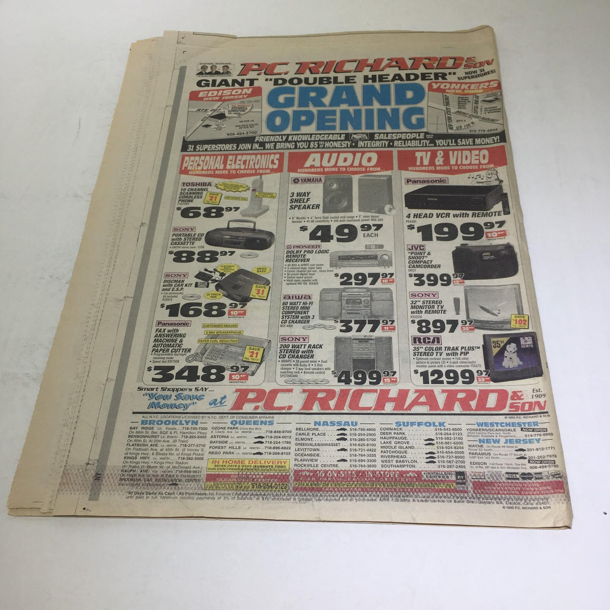 Advertisement page from New York Newsday: April 23 1995 Baseball '95 showcasing a 'DOUBLE HEADER' grand opening event with various electronics for sale.