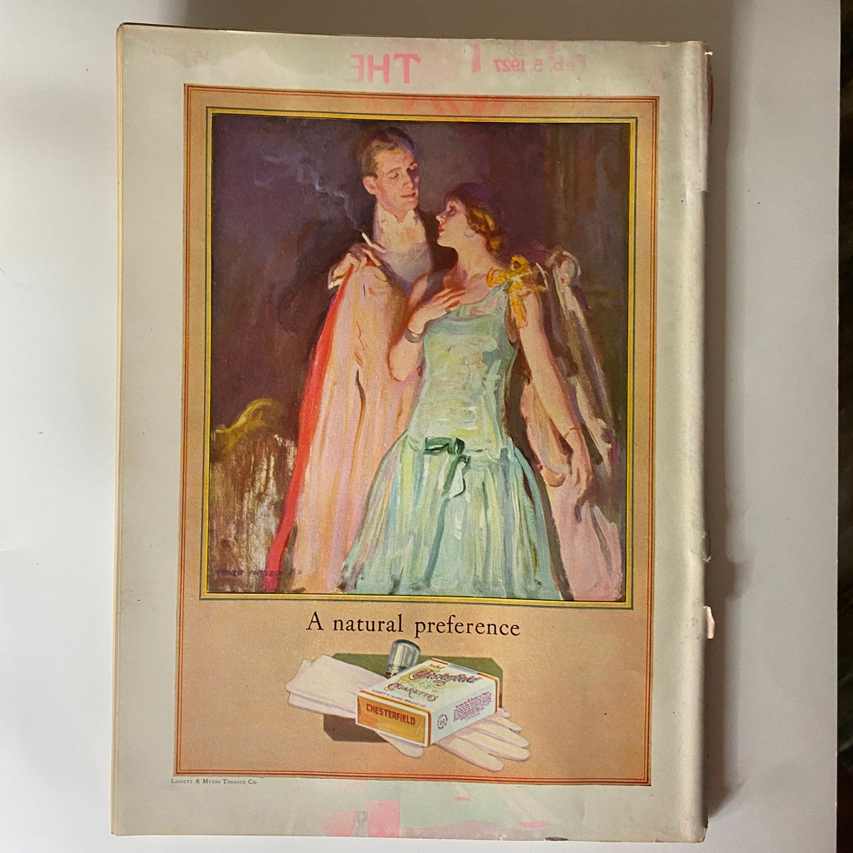 Cover page of The New Yorker magazine February 12, 1927 illustrating a romantic scene with a gentleman and lady dressed elegantly, framed with artistic flair, showcasing timeless art from the 1920s.