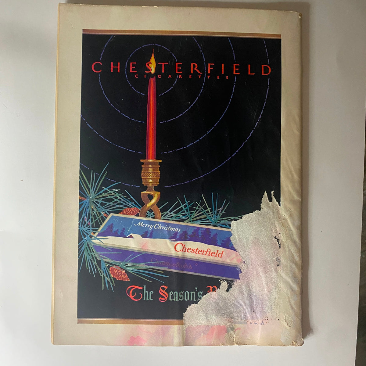 Cover page of Chesterfield Cigarettes advertisement from The New Yorker Complete Magazine December 24, 1927, featuring festive artwork with a holiday theme.