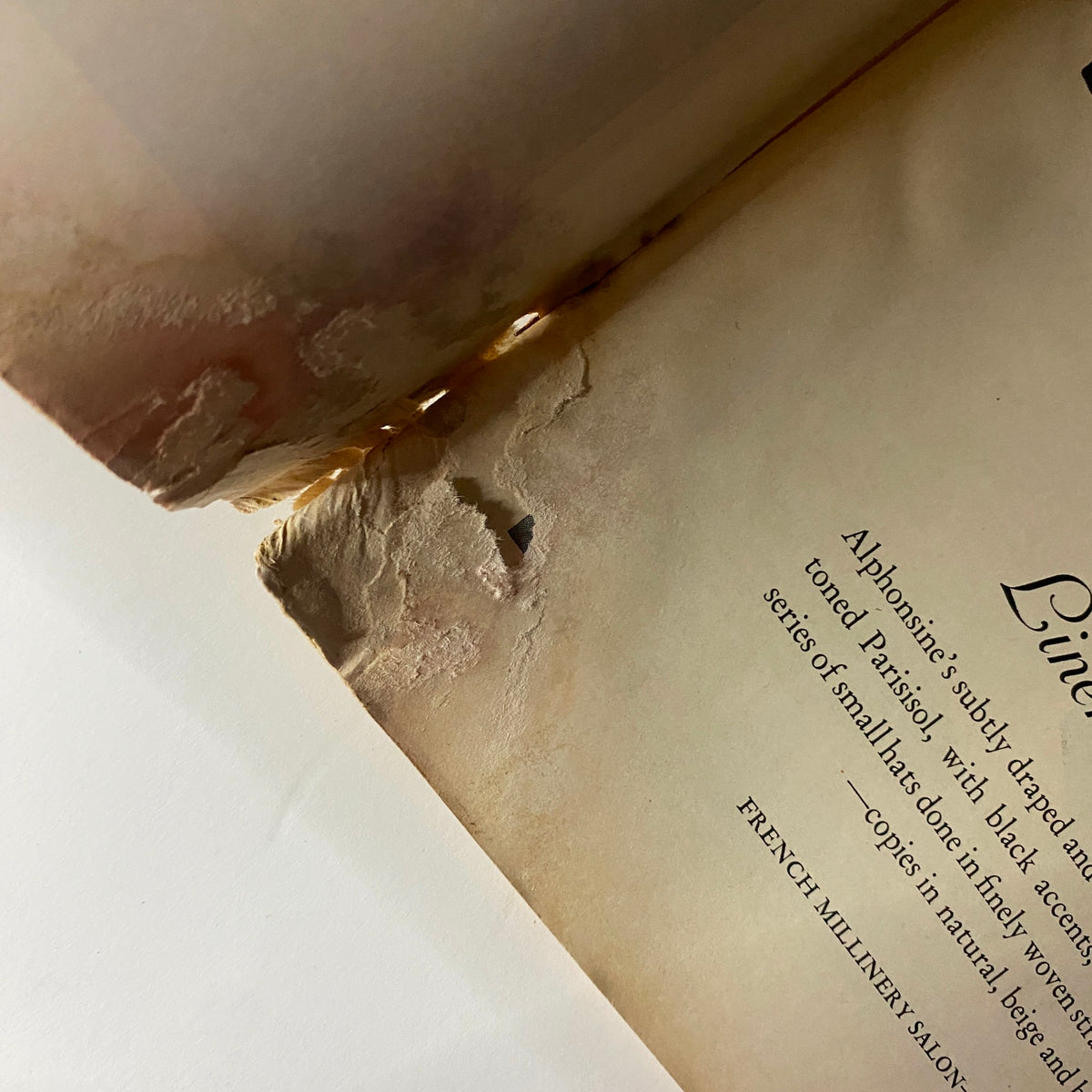 Interior detail of The New Yorker Complete Magazine February 25, 1928, highlighting page damage and discoloration.