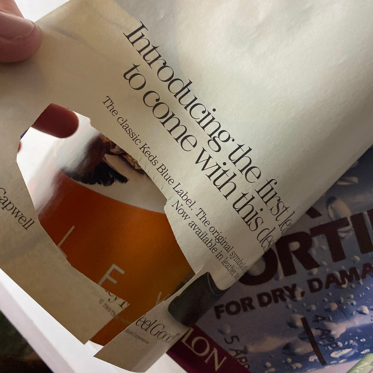 The inside page of Cosmopolitan Magazine August 1989, featuring a cut-out advertisement and showcasing the magazine's contemporary layout and design elements.