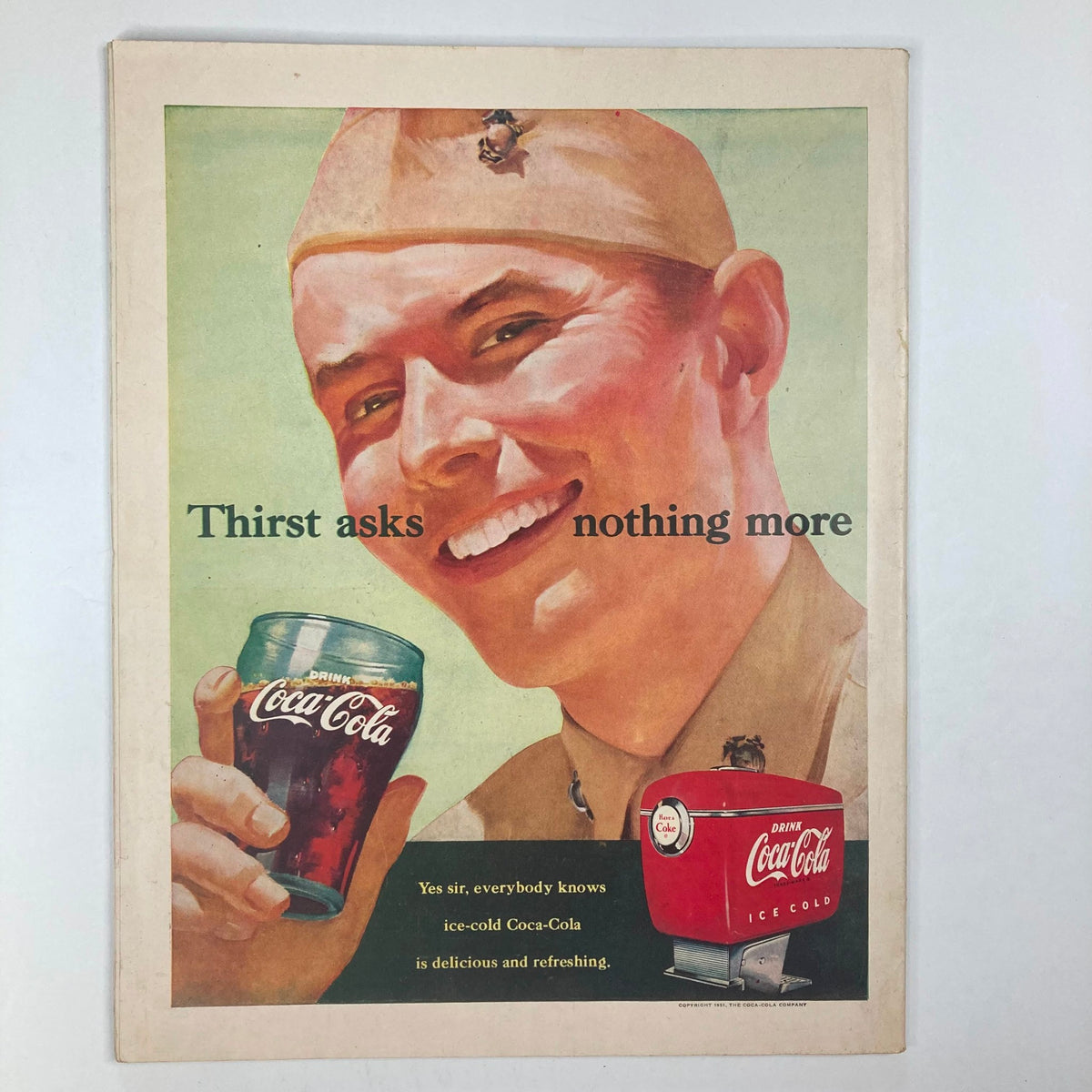 Vintage advertisement page from Collier's Magazine, April 7, 1951, presenting a smiling soldier enjoying Coca-Cola, highlighting the slogan 'Thirst asks nothing more'.