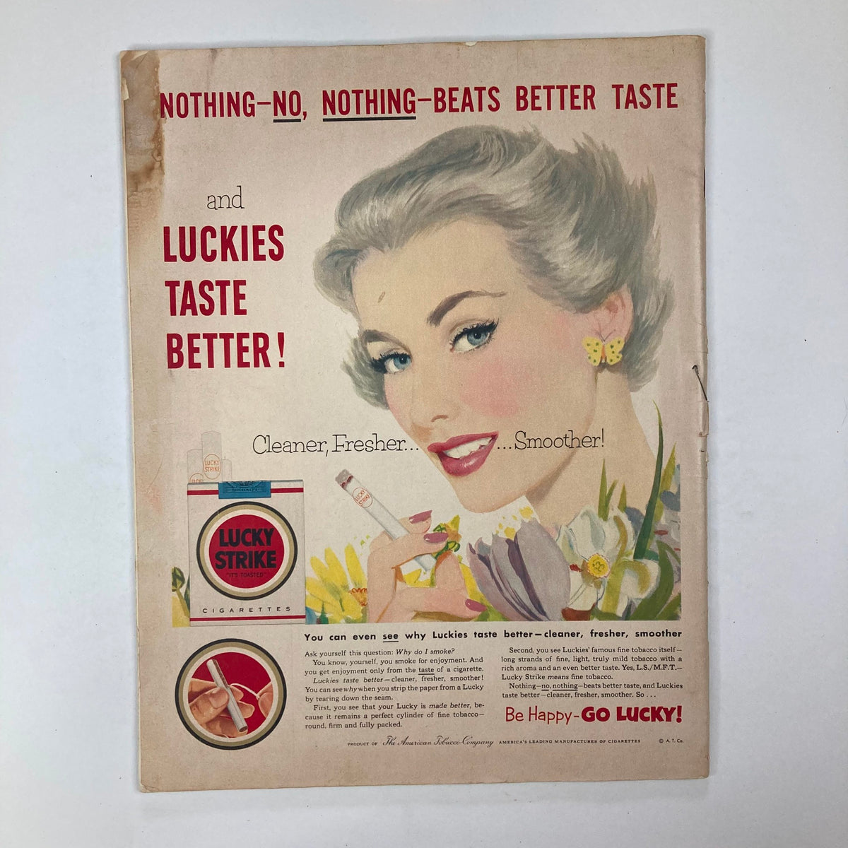 Advertisement page from Vintage Collier's Magazine April 25, 1953, featuring a glamorous woman promoting Lucky Strike cigarettes, emphasizing trends and consumer culture of the 1950s.