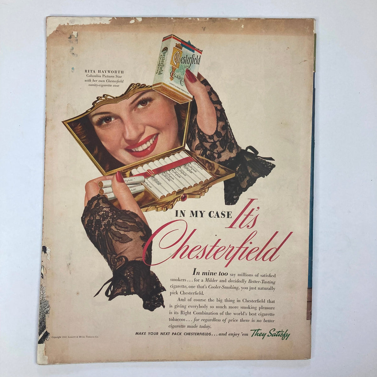 Advertisement page from VTG Collier's Magazine April 25, 1942, presenting a vintage Chesterfield cigarette ad with a smiling woman.