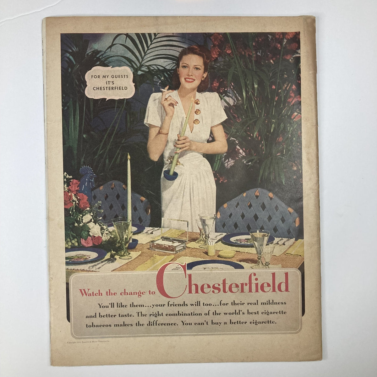 Advertisement page from VTG Collier's Magazine April 22 1944, Volume 113, Number 17 featuring a woman in a dining setting promoting Chesterfield cigarettes, highlighting vintage advertising trends.