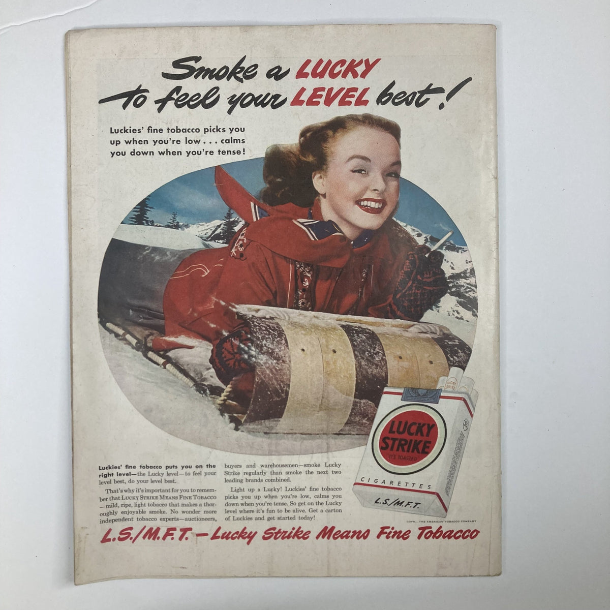 Vintage advertisement from VTG Collier's Magazine February 12 1949 Vol 123 No. 7 featuring a smiling woman in winter attire promoting Lucky Strike cigarettes, showcasing post-war advertising styles.