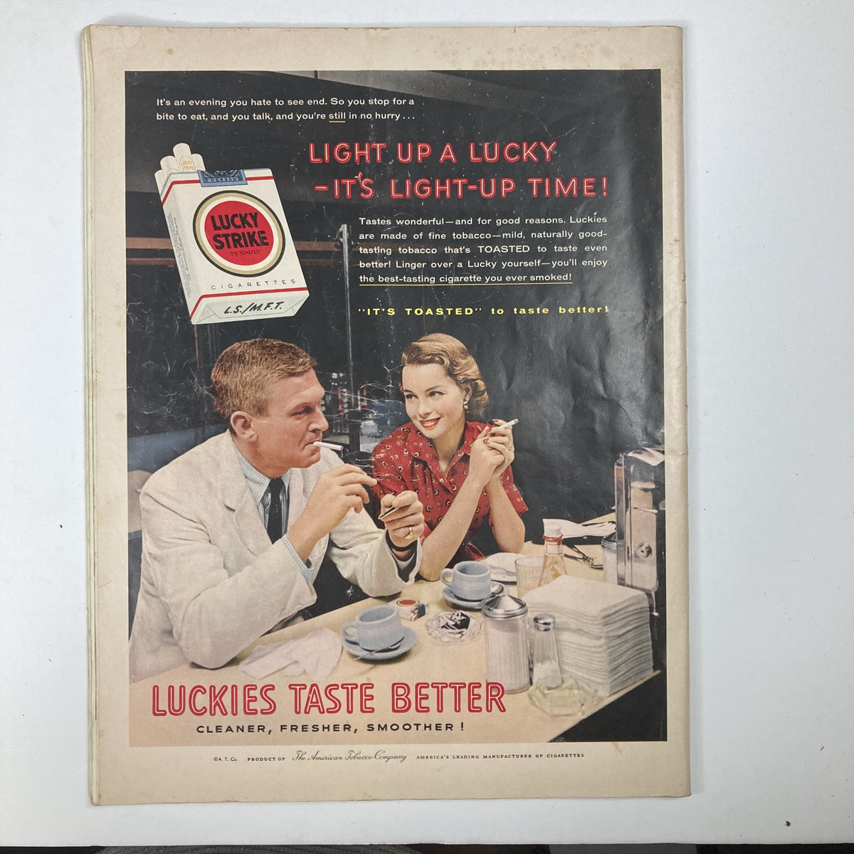 Back cover ad of Collier's Magazine August 3, 1956, Vol 138 No. 3 promoting Lucky Strike cigarettes with a couple enjoying a conversation over coffee.
