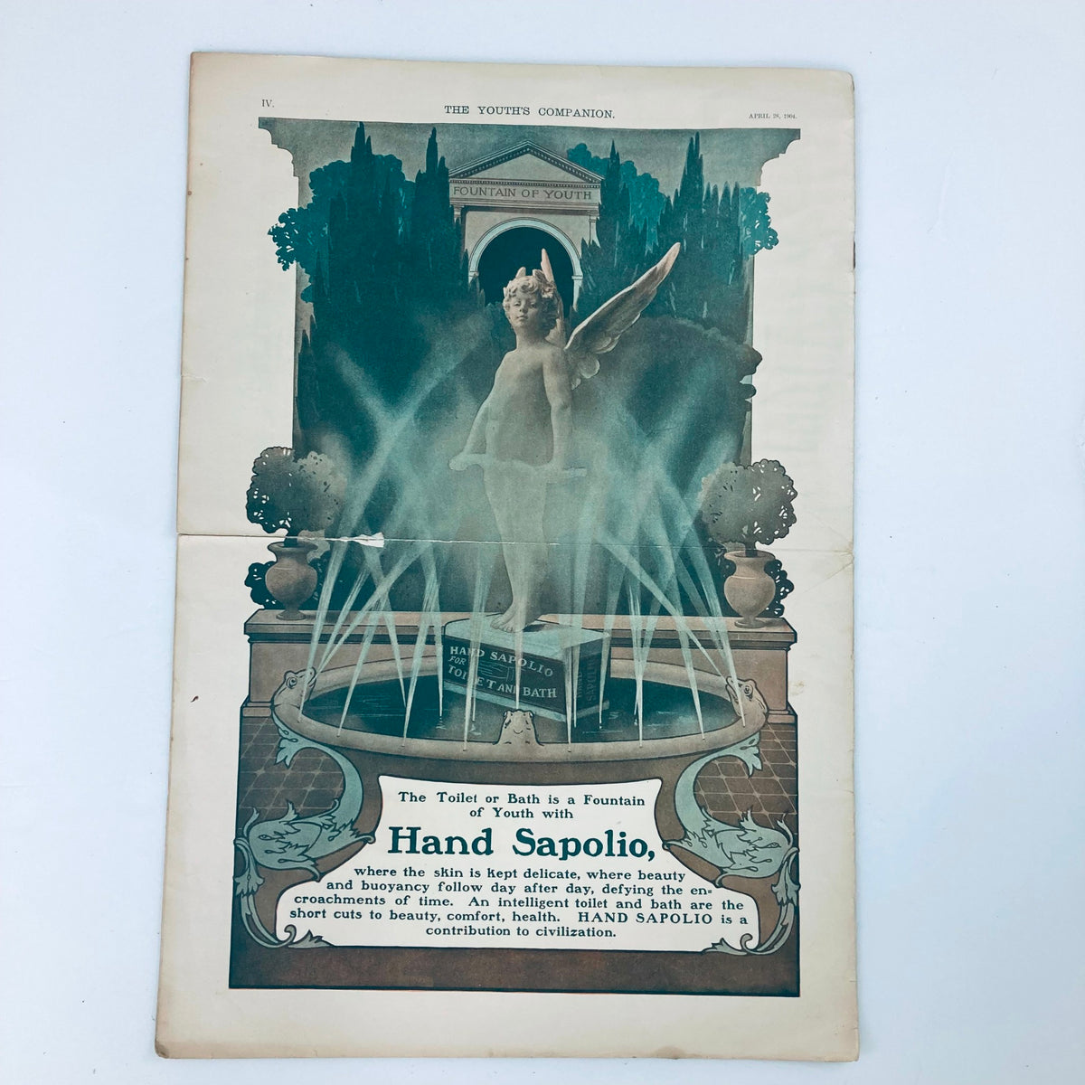 Back page of VTG The Youth's Companion Magazine dated April 28, 1904, featuring an elaborate illustration of a fountain and an angel, promoting beauty and wellness.