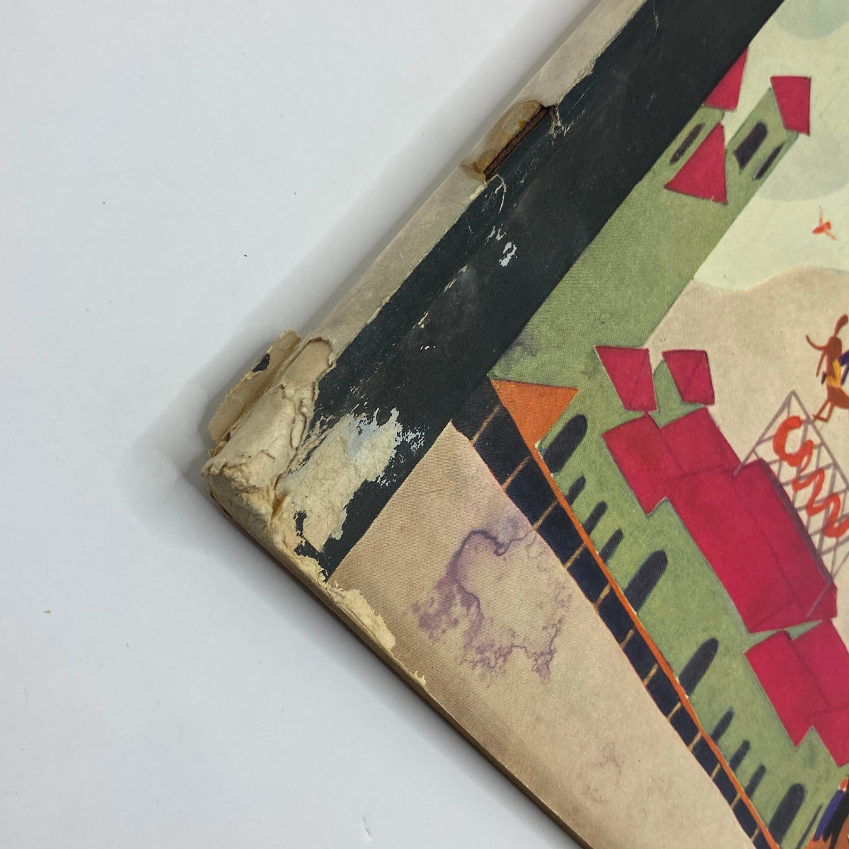 Close-up view of the corner damage on The New Yorker Complete Magazine March 31, 1928 Theodore Haupt Cover, showcasing the vintage magazine's aged condition.