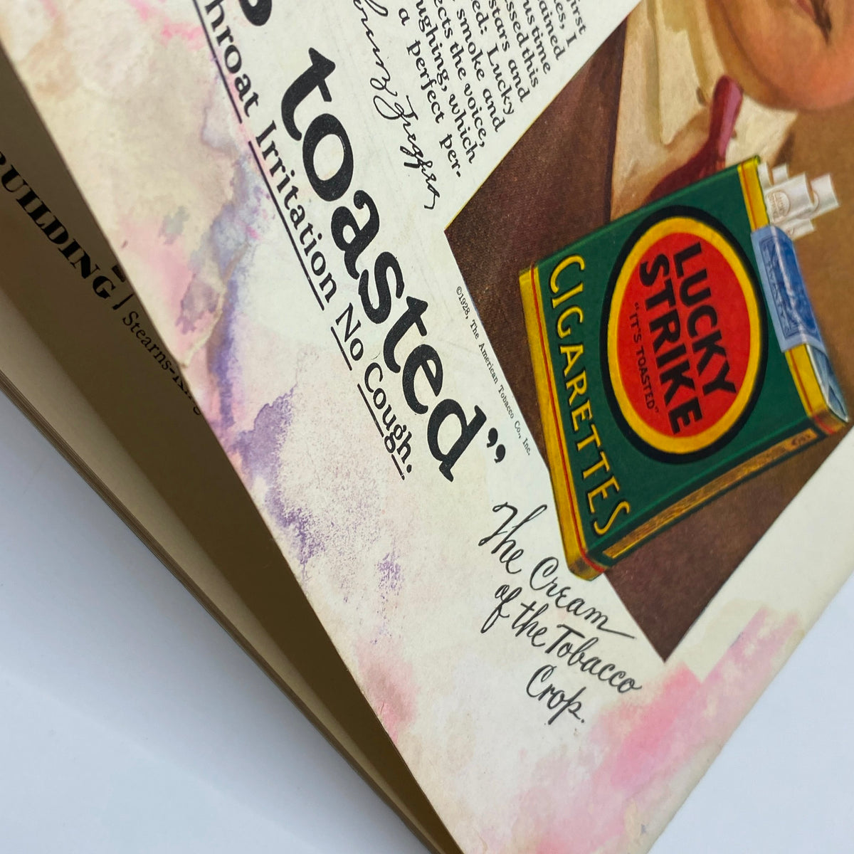Close-up detail of a vintage advertisement from The New Yorker magazine, showcasing Flo Ziegfeld and a Lucky Strike cigarette pack. The text reads 'It's toasted' and 'No Throat Irritation No Cough.' This image is from the April 28, 1928 edition.