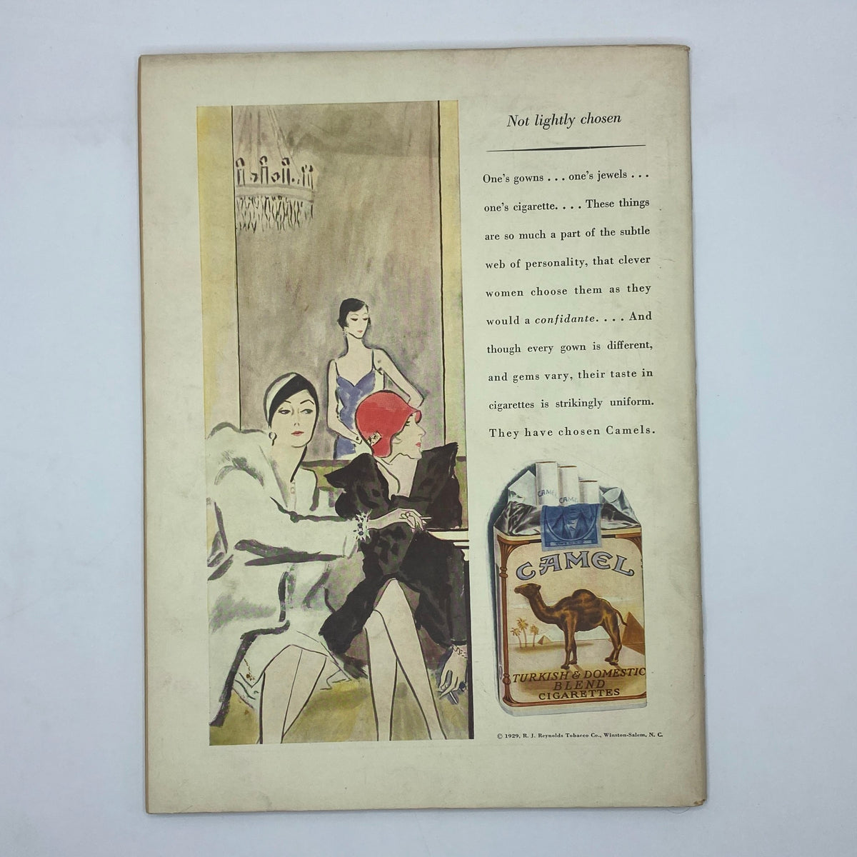 Interior page of The New Yorker magazine from June 15, 1929, featuring an artistic illustration promoting Camel cigarettes with fashionable women, capturing the essence of late 1920s advertising.