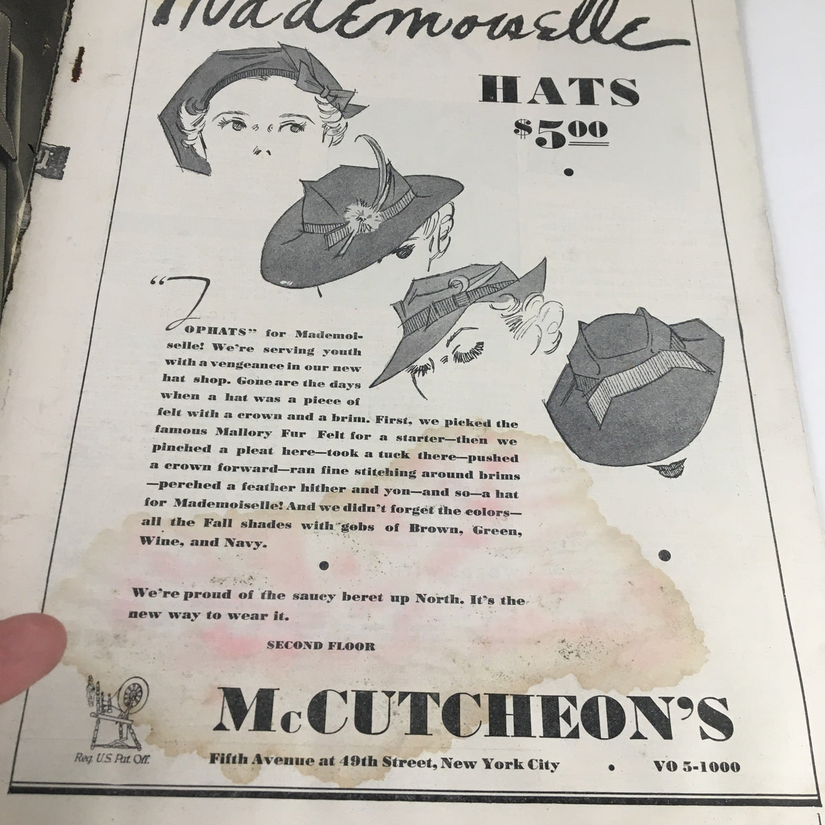 Inside page of Mademoiselle Magazine September 1935 featuring a hat advertisement with illustrated hats and prices, showcasing the fashion trends of the era.
