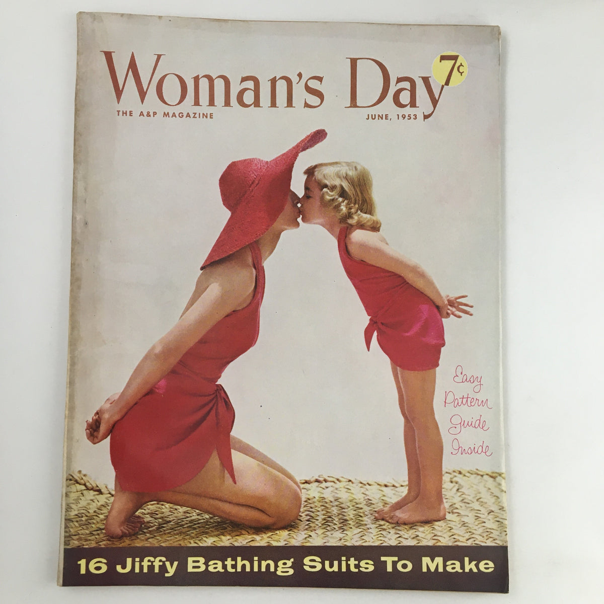 Cover of Woman's Day Magazine June 1953 featuring a woman and a girl in matching red bathing suits and hats, showcasing the headline 'The Biggest Real-Estate Deal in History.'