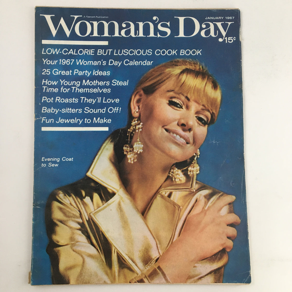 Cover of Woman's Day Magazine January 1967 featuring the title 'Low-Calorie But Luscious Cook Book' with an illustration of a smiling woman wearing earrings and a golden coat.