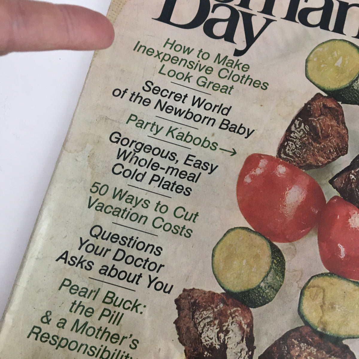 Close-up detail of the Woman's Day Magazine July 1968 cover highlighting articles including Pearl Buck's piece on motherhood and practical tips.