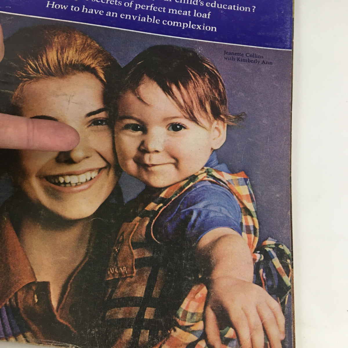 Close-up of Redbook Magazine February 1972 cover showing Jeanette Collins smiling with Kimberly Ann, emphasizing family and parenting themes.