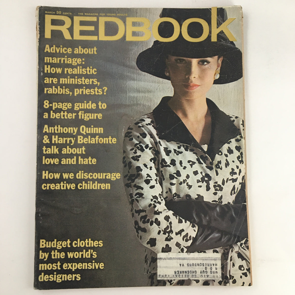 Cover of Redbook Magazine March 1963, featuring Anthony Quinn and Harry Belafonte discussing love and hate, with a model wearing a stylish outfit and a hat.