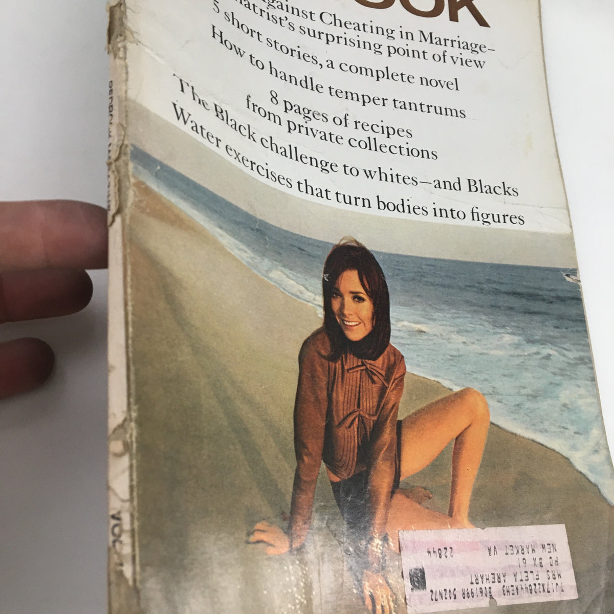 Close-up view of the Redbook Magazine June 1969 cover, highlighting the photograph of Marianne Nestor by William Cadge on a beach.