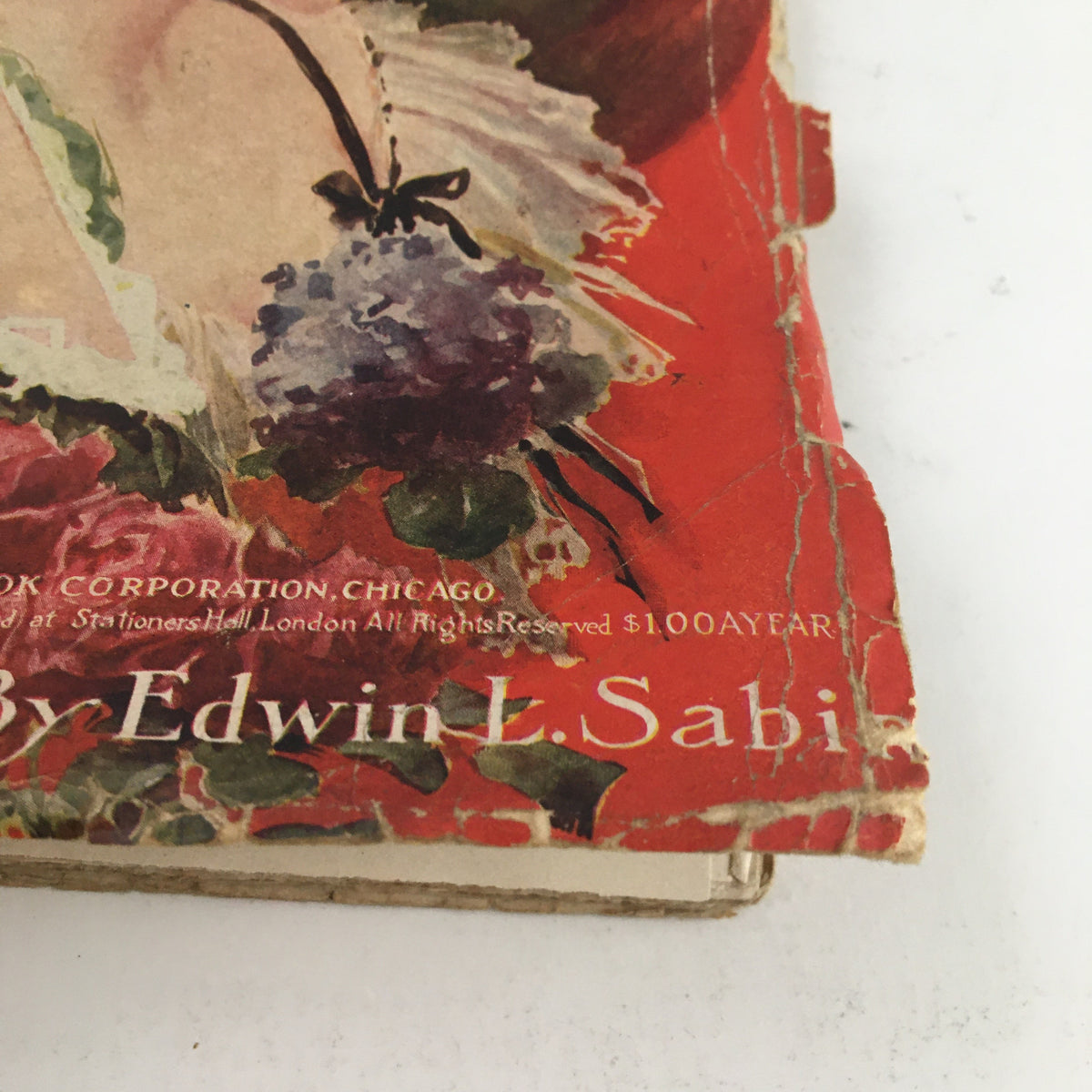 Cover detail of The Redbook Magazine January 1908 featuring artwork by Edwin L. Sabin with visible wear and vintage aesthetics.