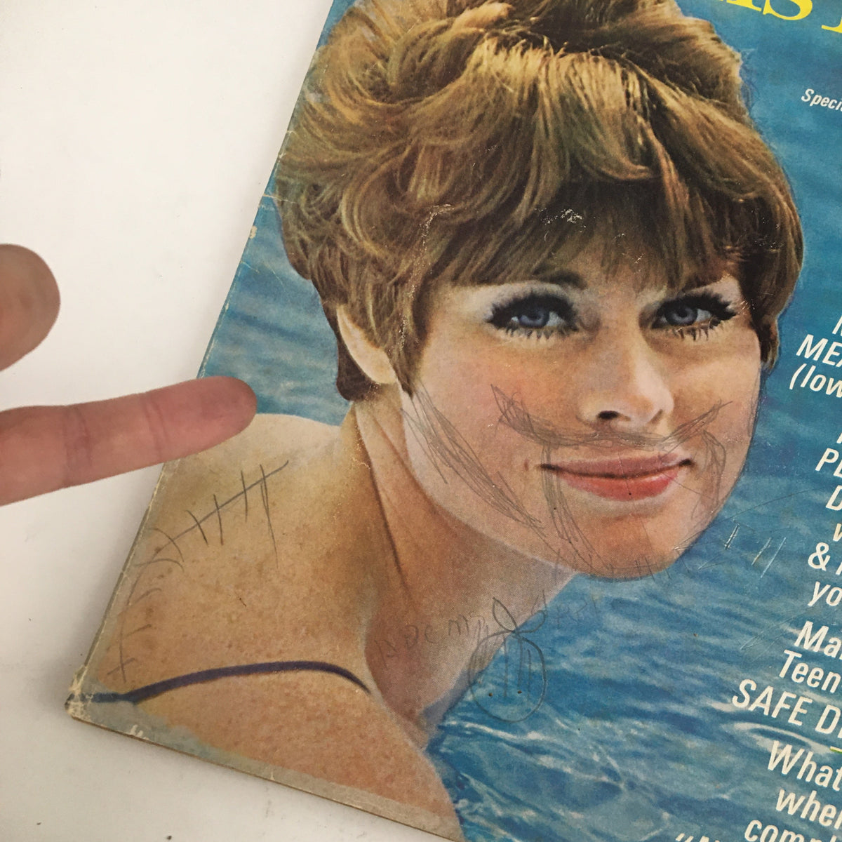 Close-up of the Woman's Day Magazine June 1967 cover showing a woman smiling, highlighting features like summer recipes and hair care advice.