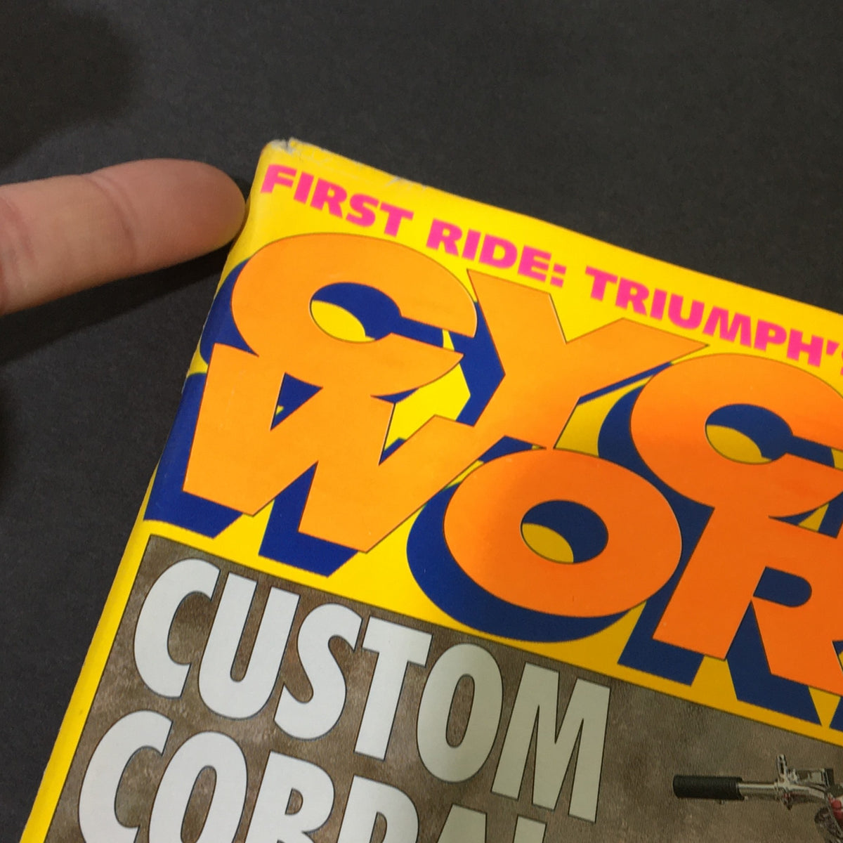 Top edge of Cycle World Magazine April 1995, highlighting the title 'CYCLE WORLD' and additional content about custom motorcycles and Triumph's new T-Bird.