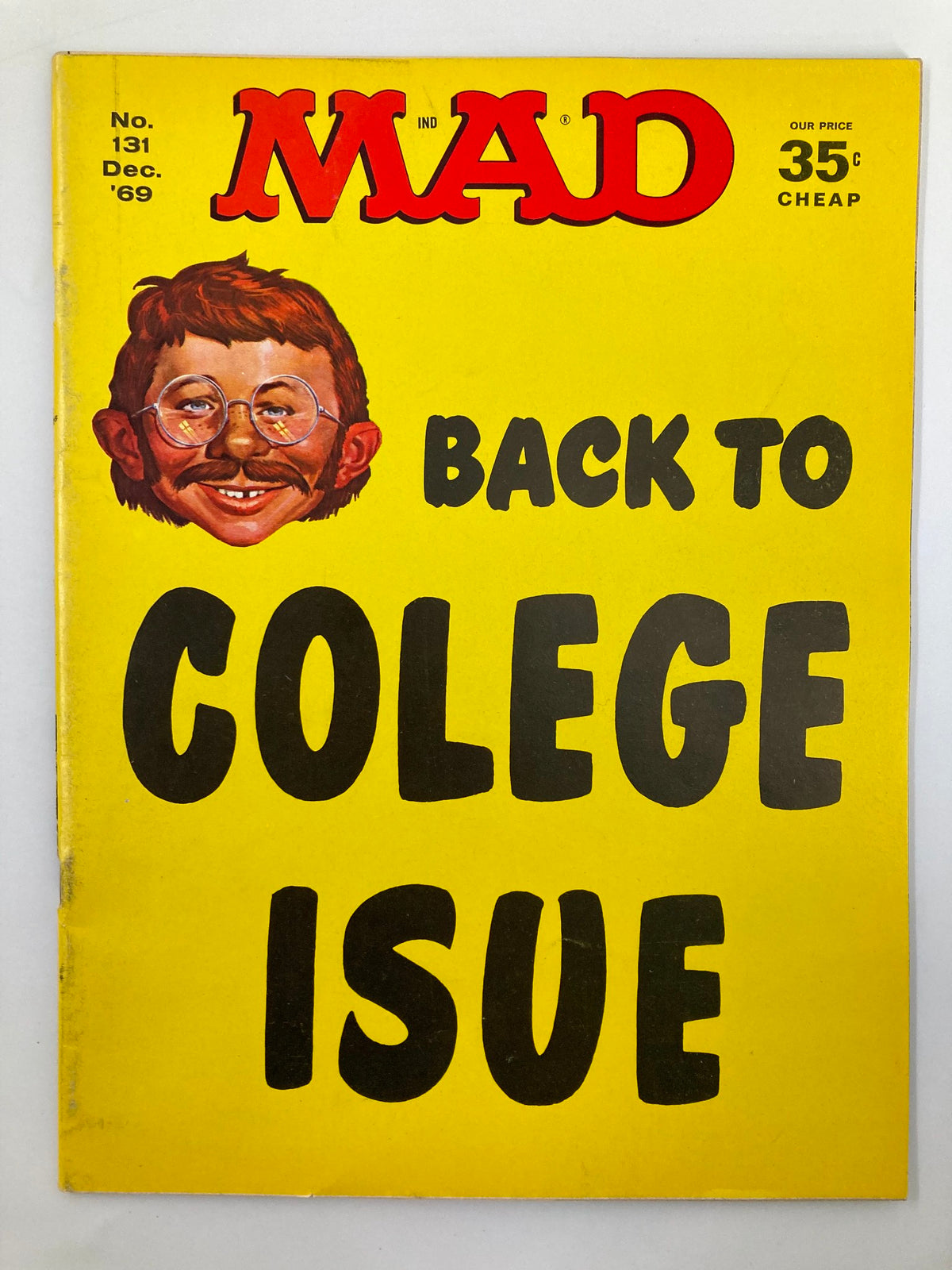 Cover of Mad Magazine December 1969 No. 131 featuring the theme 'Back to College' with bold yellow background and an illustrated character.