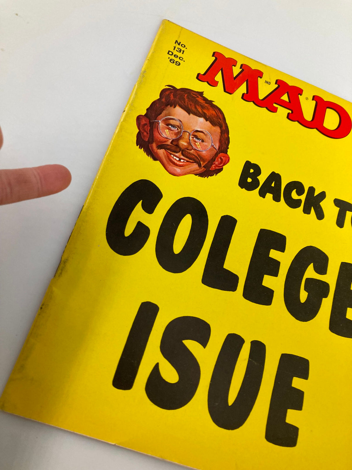 Close-up view of the cover of Mad Magazine December 1969 No. 131 highlighting the 'Back to College' theme and character details.