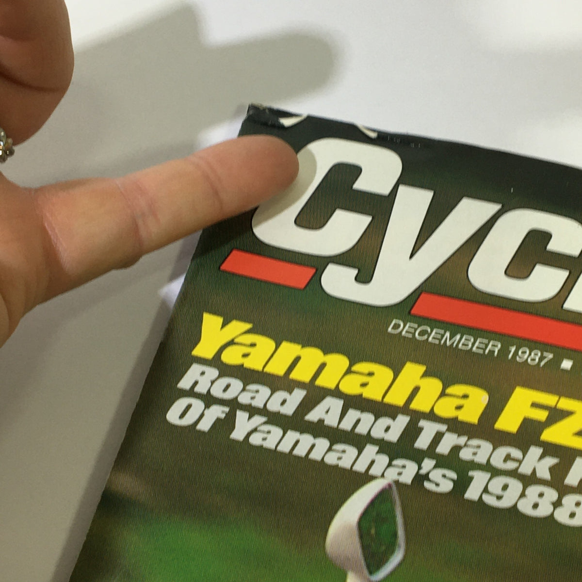 Close-up of Cycle Magazine December 1987 cover highlighting Yamaha FZR400, with text detailing road and track previews of Yamaha's 1988 models.