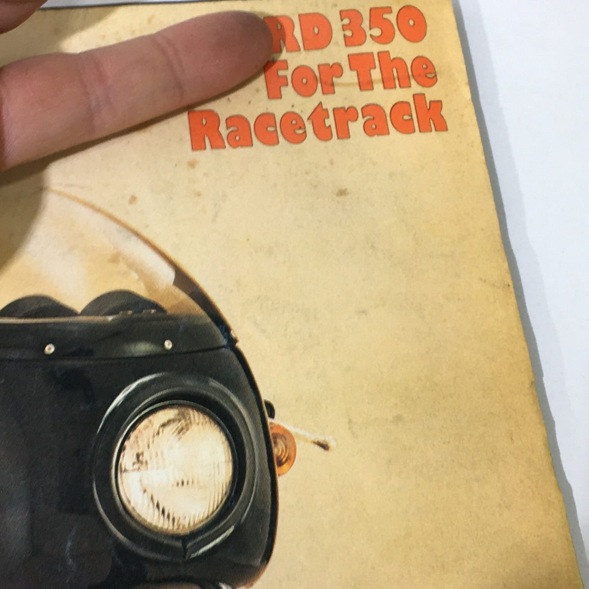 Cover of Vintage Cycle Magazine June 1975 featuring the Yamaha RD 350, with the text 'RD 350 For The Racetrack' prominently displayed alongside a close-up image of the motorcycle's headlight.