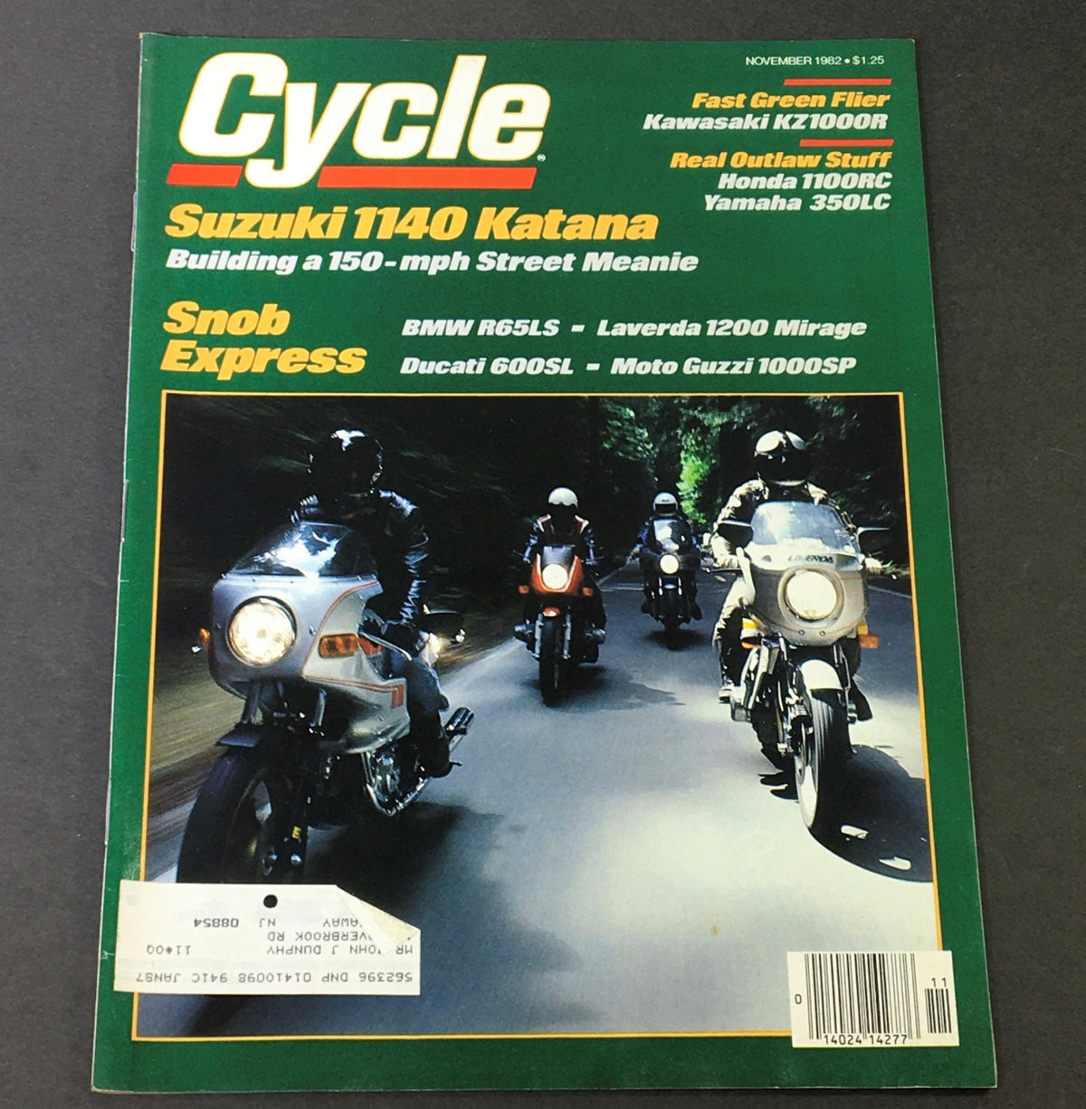 Cover of Cycle Magazine from November 1982 featuring the Suzuki 1140 Katana and Kawasaki KZ1000R, showcasing multiple motorcycles in a scenic forest setting.
