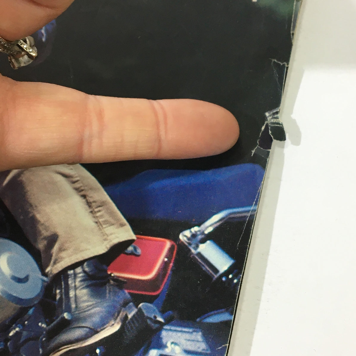 Close-up view of the October 1981 Vintage Cycle Magazine cover, highlighting the Kawasaki KZ1000J and a hand pointing to the edge of the magazine.