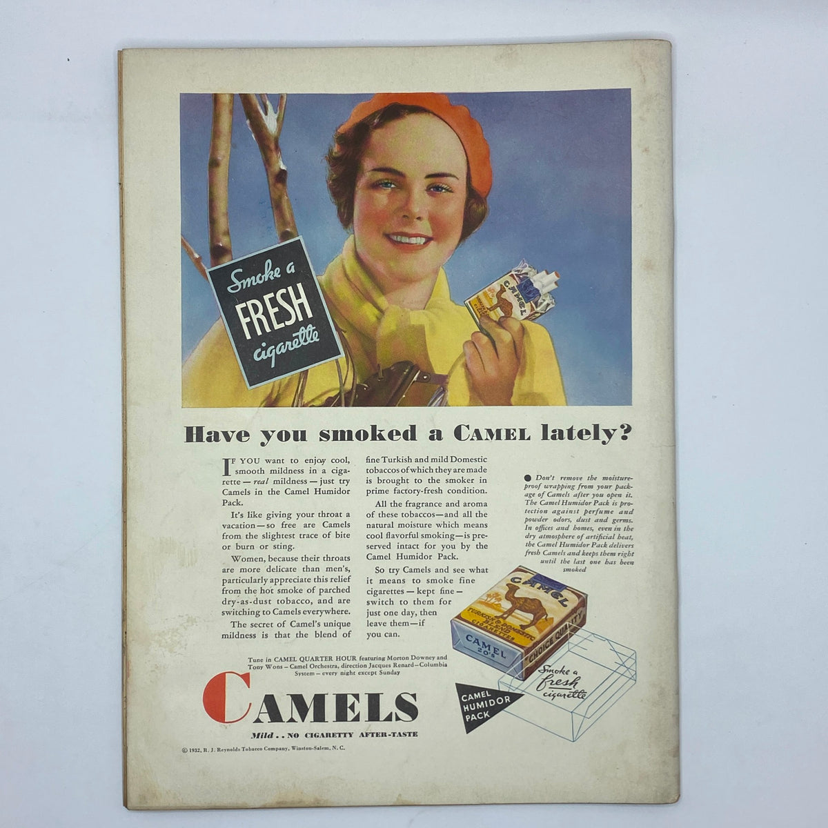 Vintage Camel cigarette advertisement from The New Yorker Complete Magazine January 23, 1932 showcasing a smiling woman promoting Camel cigarettes.