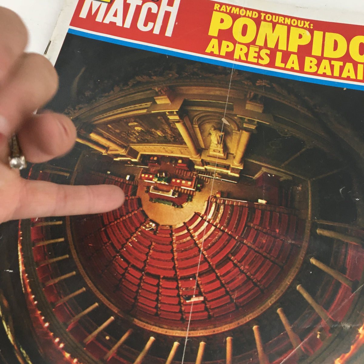 Detailed view of the cover of Paris Match Magazine March 1973 by Raymond Tournoux, showing the theater seating arrangement, symbolizing the cultural context of the Pompidou period.