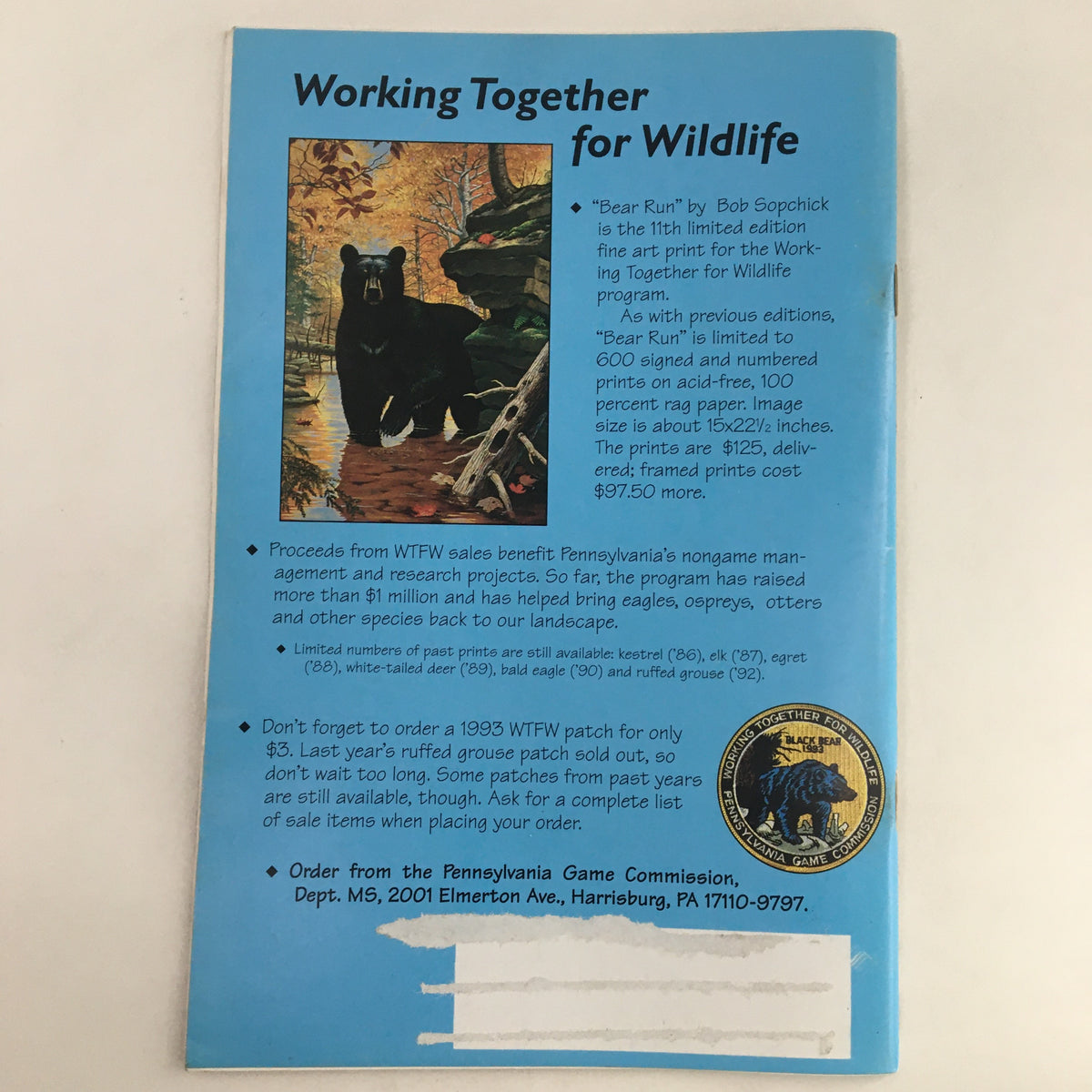 Back cover of Pennsylvania Game News September 1993 featuring 'Working Together for Wildlife' campaign. Displays art print 'Bear Run' by Bob Sopchick, details about the program, and ordering information. Includes a depiction of a bear in a forest setting.