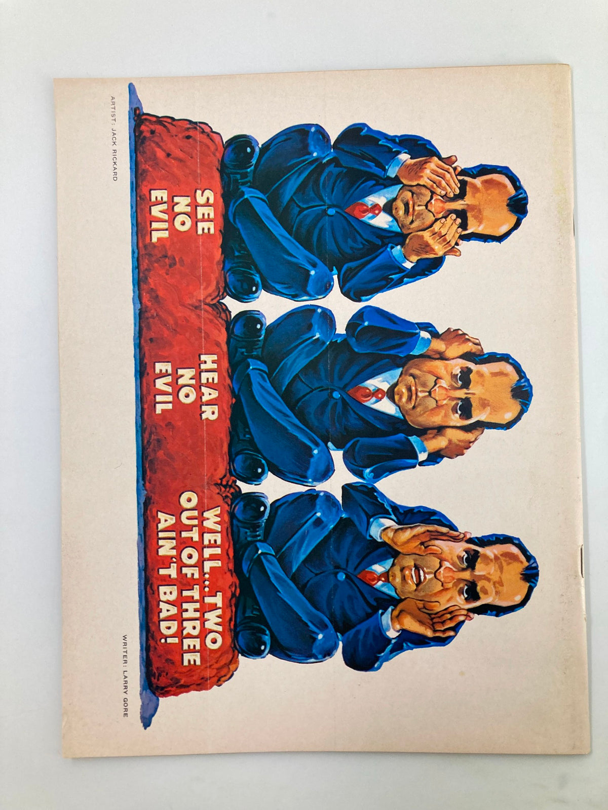 Back cover of Mad Magazine December 1971 No Alfred! illustrating a humorous depiction of three figures with the text 'SEE NO EVIL, HEAR NO EVIL, WELL... TWO OUT OF THREE AIN'T BAD!'.