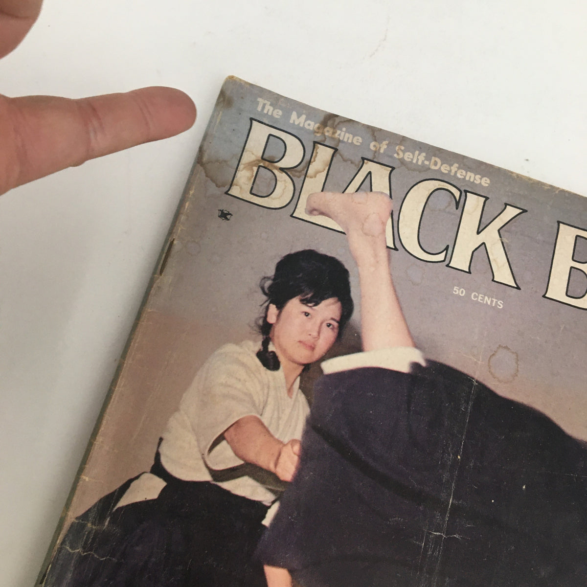 Cover of Black Belt Magazine December 1964 featuring Mariye K. Yano demonstrating a judo throw, highlighting martial arts history.