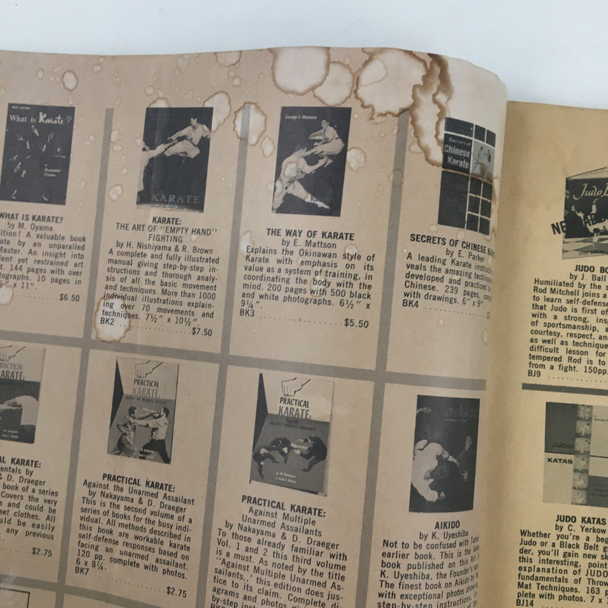 Interior page of Black Belt Magazine December 1964 showcasing advertisements for martial arts books, reflecting the growing interest in karate and self-defense.