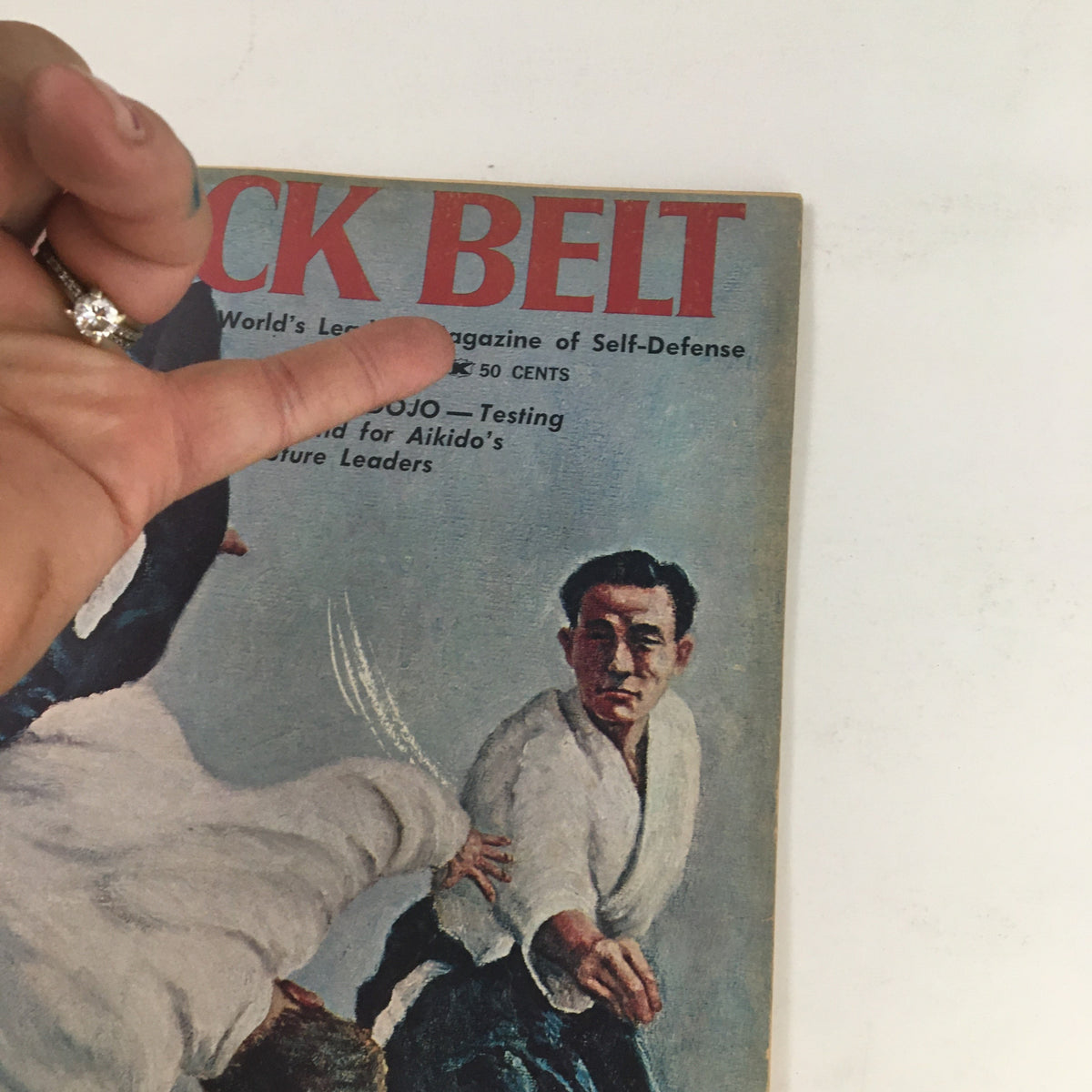 Detailed view of the cover of Black Belt Magazine May 1966, Vol. 4 No. 5 with focus on Aikido action and Waka Uyeshiba, providing an insight into the martial arts culture of the 1960s.