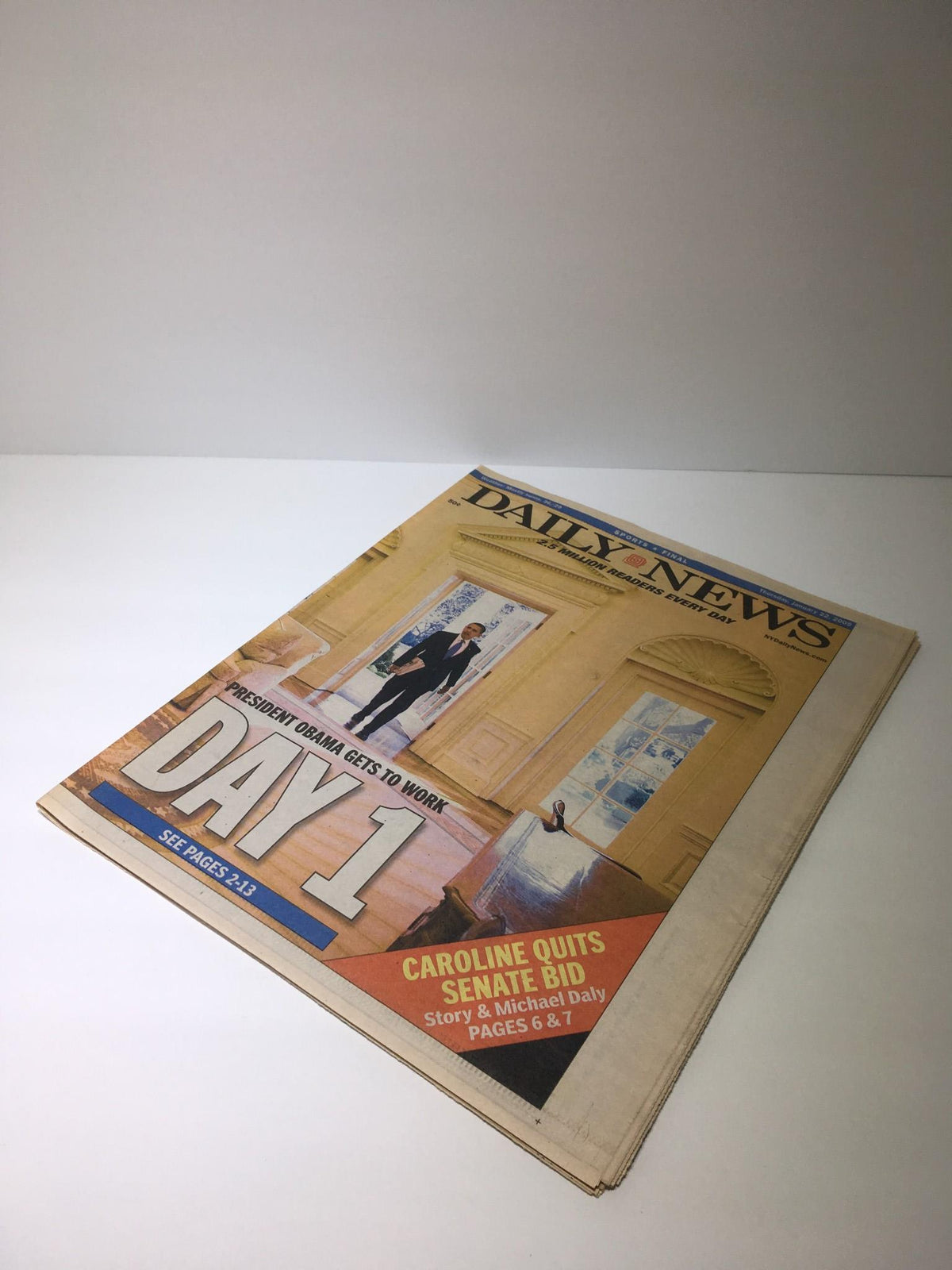 Cover of NY Daily News from January 22, 2009 featuring the headline 'President Obama Gets To Work' with an image depicting a bright room, symbolizing the beginning of a new administration.