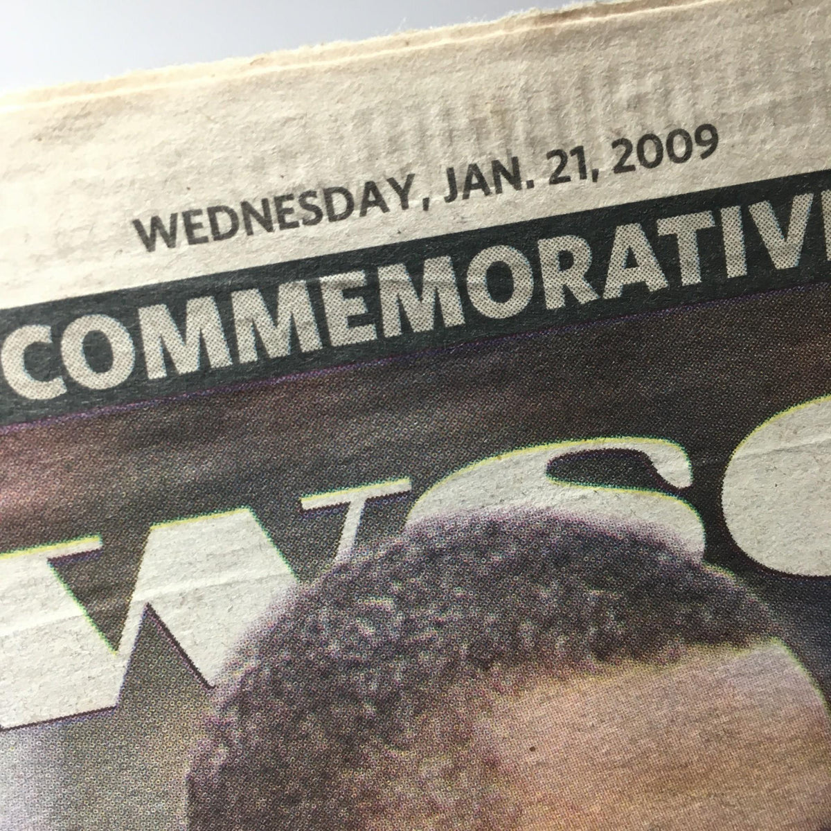 Close-up of NY Daily News featuring the date 'WEDNESDAY, JAN. 21, 2009,' in commemorative section related to Barack Obama's inauguration.